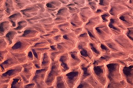 sand ripples on a beach creating nice linear patternsの写真素材