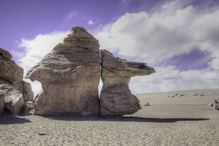 big rock formation in sand desert on Bolivian altiplanoの写真素材