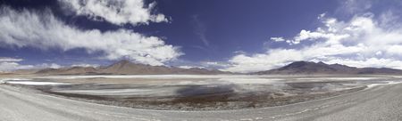 red lagoon or laguna colorada on the altiplano Bolivia high in the andes panorama with copy space blue sunny dayの写真素材