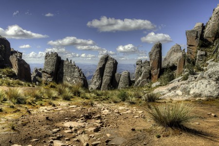 Andes scenic landscape beautiful blue sky white clouds big rocksの写真素材
