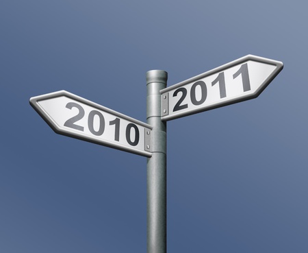 road sign two arrows indicating to past and future 2010 and 2011 old to new yearの写真素材