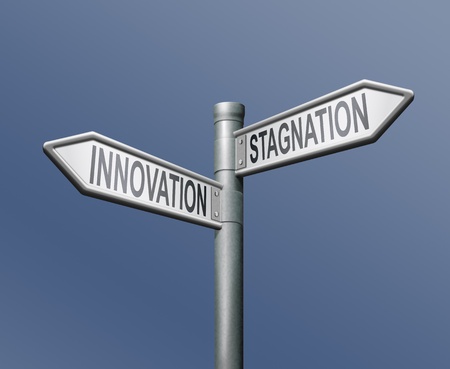 innovation stagnation road sign arrow progress or standing still innovate and move ahead become market leaderの写真素材