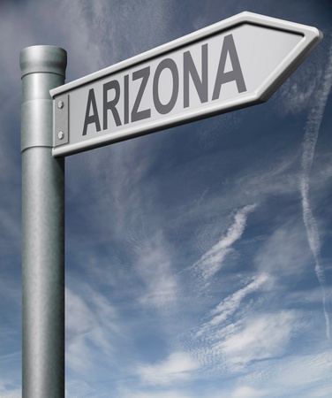 Arizona road sign arrow pointing towards one of the united states of america signpost の写真素材