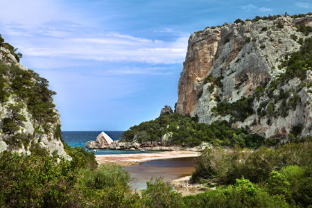 cliffs at idylic beach coast hiliday paradise blue sky and sea white sand sardinia Italy tourism vacationの写真素材