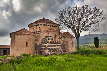 Medievel church Santa Sabina in Sardegna Italy with dark clouds historical building sardinia Italy travel and tourism historyの写真素材