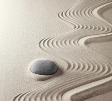 zen buddhism spiritual japanese rock garden abstract harmony and balance concept for purity concentration meditation and spa relaxation sand and stoneの写真素材