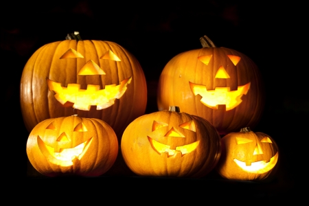 Halloween lantern head pumpkins scary spooky and creepy faces in the dark nightの写真素材