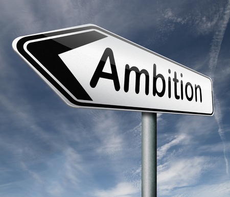 Ambition road sign pointing way to success guarantee to reach your goals and go to the topの写真素材