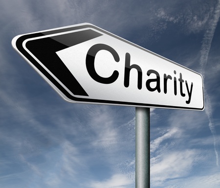 charity raise money to help donate gifts fundraising give a generous donation or help with the fundraise road sign arrowの写真素材