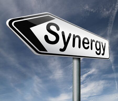 synergy or combined effort working together team work road sign arrow textの写真素材