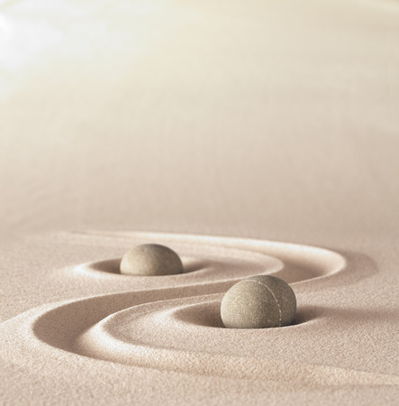 zen garden meditation stone background with copy space stones and lines in sand for relaxation balance and harmony spirituality or spa wellnessの写真素材