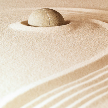 spa and zen background sand and stone with lines relaxation and meditation concept for purity...