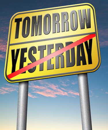 yesterday tomorrow living in the past or in the future road sign arrowの写真素材