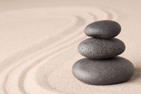 spa wellness hot stone therapy or zen meditation stones and sand for relaxation and concentration.の写真素材