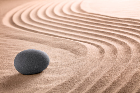Japanese zen stone and sand garden for Buddhism meditation or a spa wellness backgroudn with copy space. の写真素材