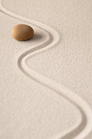 Minimalism zen sand and stone composition. Concept for meditation relaxation and concentration. Spiritual minimal background with copy space.の写真素材