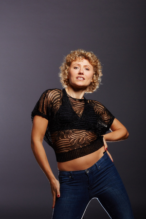 Blonde curly woman on the dance floorの写真素材