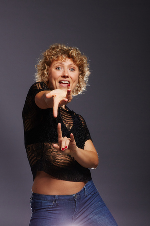 Blonde curly woman lures with the handsの写真素材