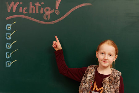 Girls and important list on the boardの写真素材