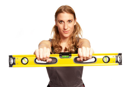 Young woman with a spirit level