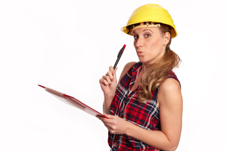 Young woman with hard hat and writing board
