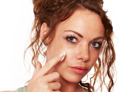Woman with natural skin carries a face creamの写真素材