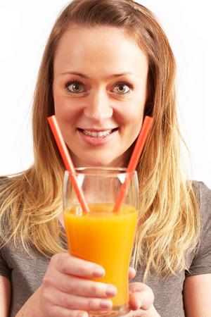Young pretty woman with Orange Juiceの写真素材