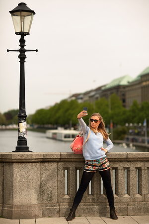 Girl as a tourist to the city tour in Hamburg..の写真素材