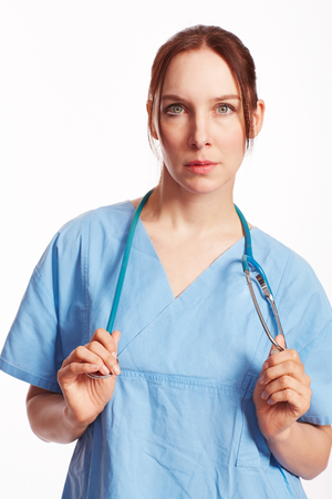 Nurse in blue dress with Op stethoscope as Cutの写真素材