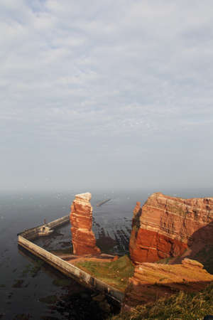 Cliff line of Heligoland with the Tall Anna, the landmark of Heligoland.の写真素材