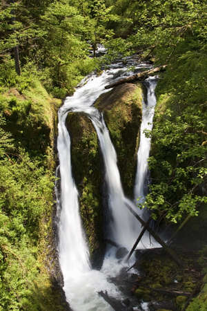 Beautiful Image of three flowing waterfalls on Ainsworth Hiking Trail.の写真素材