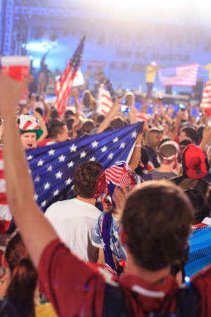 RIO DE JANEIRO - JUNE 16: Hundreds of American World Cup Fans gather at the FIFA Fan Fest in Praia do Copacabana to watch the USA vs Ghana match on the giant screen.のeditorial素材