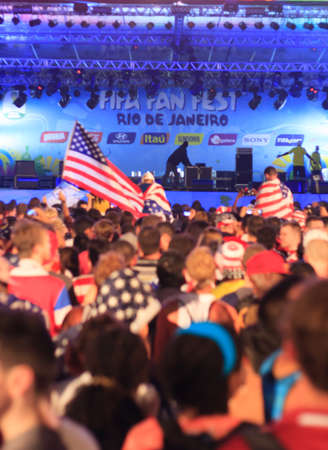 RIO DE JANEIRO - JUNE 16: Hundreds of American World Cup Fans gather at the FIFA Fan Fest in Praia do Copacabana to watch the USA vs Ghana match on the giant screen.のeditorial素材