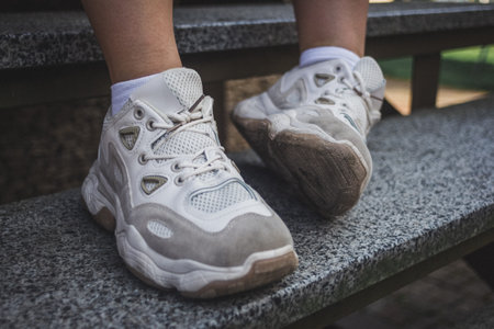 Close up picture of girls white sneekers