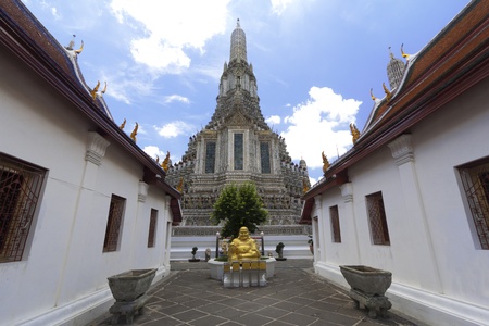 Golded Fat Buddha at Wat Arun (Temple of Dawn) With Blue Skyの写真素材