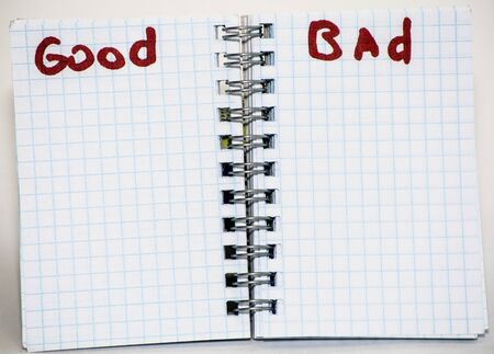 Turn the notebook. Inscriptions marker of "good", "bad".の写真素材