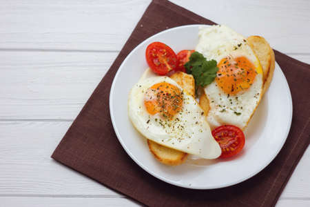 Egg toasts with tomatoesの写真素材