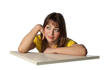 young woman in yellow t-shirt shows emotionsの写真素材