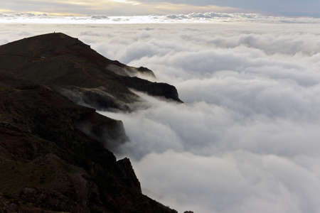 view of the clouds with the peak of Mountの写真素材
