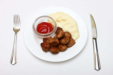 photo of plate with meatballs on white backgroundの写真素材