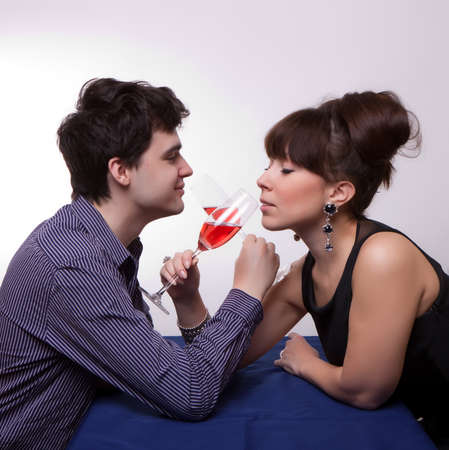 photo of young couple drinking rose wineの写真素材