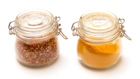 photo of multi-colored spices on white background