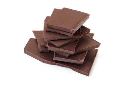 chocolate pieces on white background