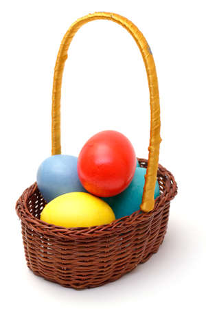 easter eggs in basket on whiteの写真素材