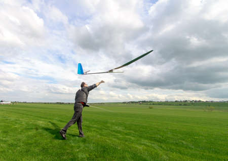 Man launches into the sky RC glider, wide-angleの写真素材
