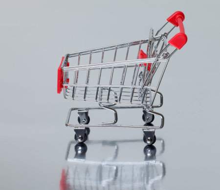 Shopping Cart isolated on silver backgroundの写真素材