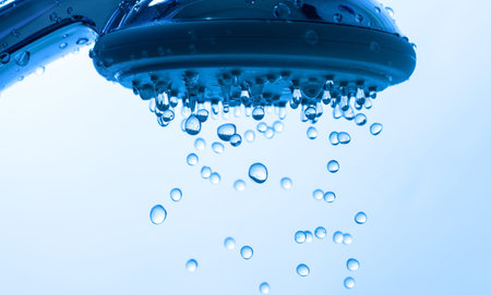 Shower Head with Droplet Water, Blue backgroundの写真素材