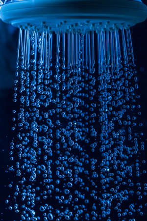 Shower Head with Droplet Water, Dark backgroundの写真素材
