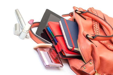 Pink Leather Ladies Handbag with Tablet PC on white backgroundの写真素材