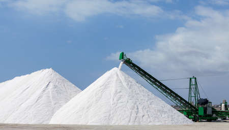 Extraction of salt  Salt mountains on blue sky の写真素材